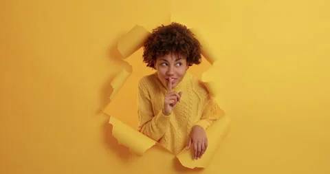 Hey you come here. Pleased cheerful dark skinned woman beckons with inviting Stock Footage 143172018