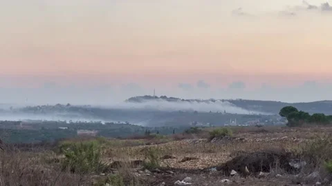 Hezbollah launches missiles and attacks on five points in Israel, which responds Video stock 253210643