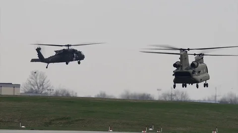 HH-60 Medevac Black Hawk and CH-47 Chinook hover during flight pattern training Video stock 88396262