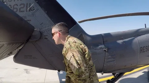 HH-60 Pave Hawk crew member conducts pre-flight walk around checks Видео 108378836