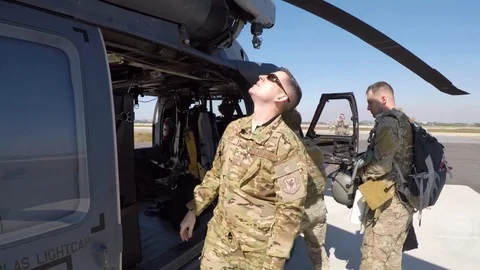 HH-60 Pave Hawk crew member conducts pre-flight walk around checks Видео 108378844