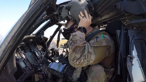 HH-60 Pave Hawk pilot securing flying helmet Stock Footage 108378902