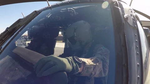 HH-60 Pave Hawk pilot conducting pre-flight cockpit checks Видео 108378920