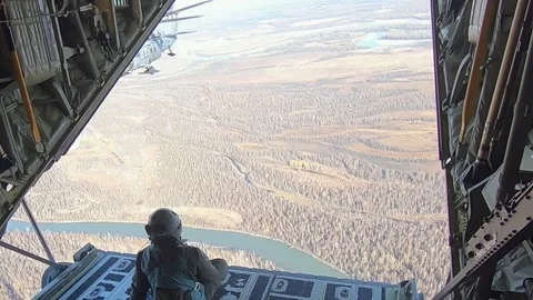 HH-60G Pave Hawk approaching for air-to-air refueling over Alaska Stock Footage 254066659