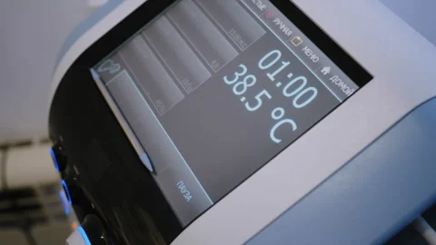 Hi-Tech Massage Therapy: Device Displaying Temperature and Vital Data Stock-Footage 306273170