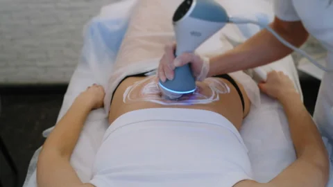 Hi-Tech Stomach Therapy Captured in Tilt-Up Shot Vidéo 306273390