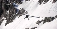 Hi Wing Bush Plane With Skis Flying Past Avalanche Cliffs And Crags Stock Footage