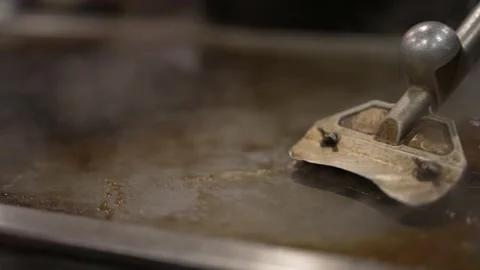 Hibachi grill cleaned with tool Stock Footage 162146073