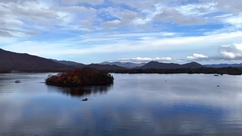 Hibara Lake Calm Water Reflection and Clouds Aerial 4K Stock Footage 329053694