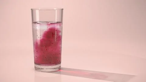 Hibiscus Iced Tea Ruby Concentrate Pour Blooming in Glass Stockbeeldmateriaal 347457623