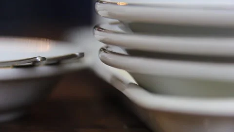 Hidden Ant Between Stacked White Plates in Minimal Kitchen Scene Stock Footage 331931296