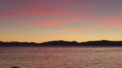 Hidden Beach Sunset Over Lake Tahoe - Shallow Depth of Field - Camera Tilt Stock Footage 148255883