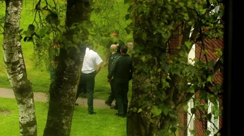 Hidden camera - group of paramedics have a team brief. Stock Footage 40557735