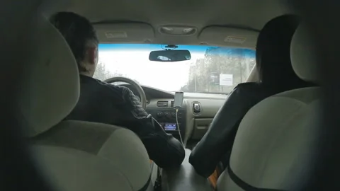 Hidden camera shoots the driver behind the wheel and his girlfriend, Video stock 121231777