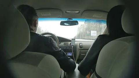 Hidden camera shoots the driver behind the wheel and his girlfriend, Video stock 121594579