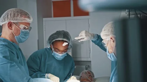 Hidden camera view of the surgeon man inputting drug for local anesthesia during Stock Footage 144852765