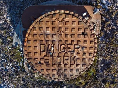 Hidden dangers beneath caution advised Stock Photos