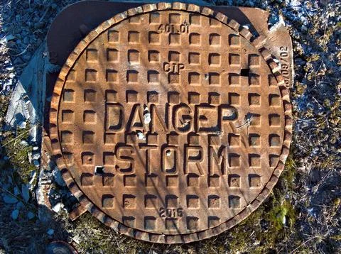 Hidden dangers beneath caution advised Stock-Fotos