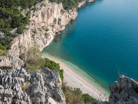 Hidden empty beach and calm blue sea on sunny day Stock-Fotos