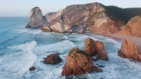 A hidden gem of hard accessible beach with rough rock formations Video stock 162291744