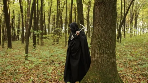 Hidden identity, Shadowy figure, Concealed weapon Stock Footage 293087238