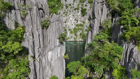 Hidden Lagoon Surrounded by Limestone Cliffs and Kayakers Stock Footage 295794279