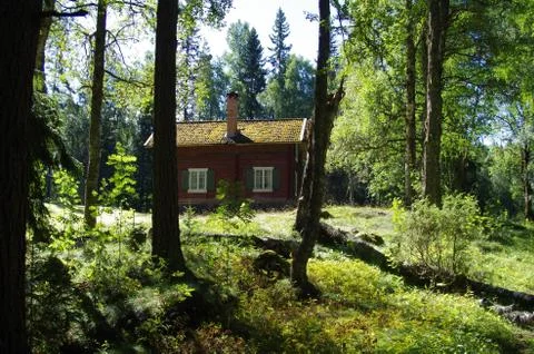 Hidden log cabin Stock Photos