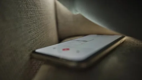 Hidden mobile phone is using voice recording app to capture conversation 스톡 동영상 312845610
