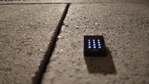 A hidden passage is concealed within the concrete floor, marked only by a subtle Stock Footage 304287533