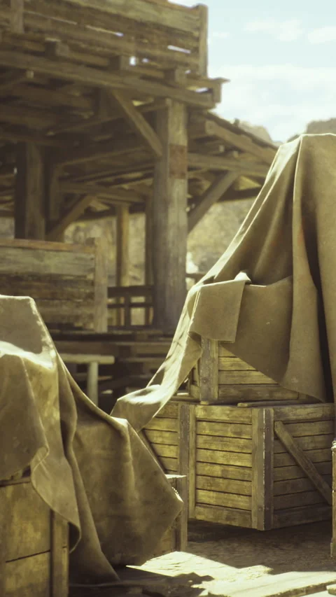 Hidden treasures wrapped in cloth at a rustic wooden barn under bright sky Stock Footage 331841162
