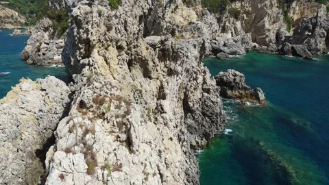 Hidden Turquoise Cove Between Dramatic Cliffs – Aerial Drone Footage Stock Footage 315073801