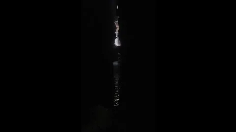 Hidden Waterfall in a Dark Canyon with Narrow Gap in Pokhara, Nepal Stock Footage 297086161