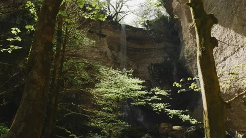 Hidden waterfall in tropical rainforest. Drops of water falling Stock Footage 204866164