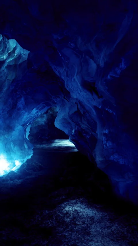 Hidden wonders within the blue ice cave at twilight in a secluded location 库存影片 334245468