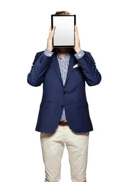 Hide the face behind digital tablet Stock Photos