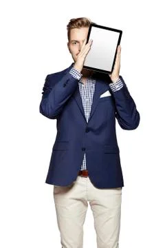 Hide the face behind digital tablet Stock Photos