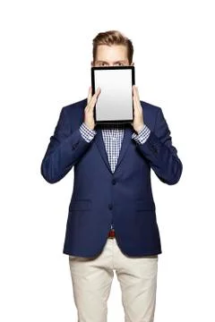 Hide the face behind digital tablet Stock Photos