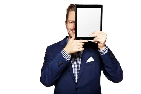 Hide the face behind digital tablet Stock Photos