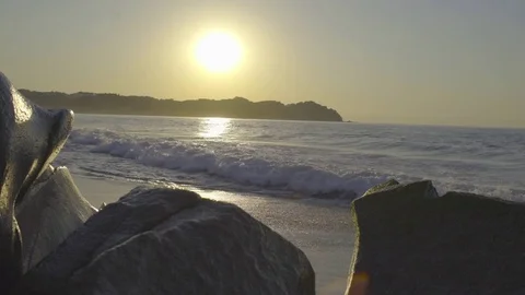 Hide Tide Sunset Waves hitting the beach Stock Footage 83021267