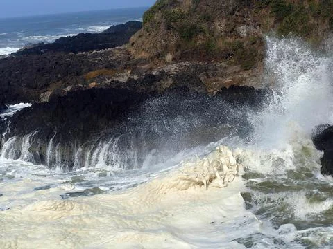 Hide tide waves foam in Devil's Churn Stock Photos