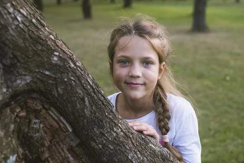 Hiding behind tree Stock Photos