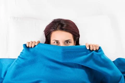 Hiding beneath the blanket Stock Photos