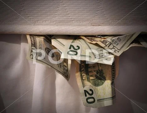 Hiding money in mattress Stock-Fotos