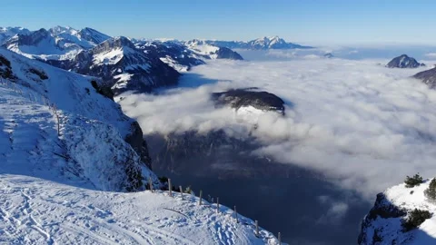 High above the clouds and Lake Lucerne in the Swiss Alps Stock Footage 169048709