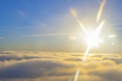 High above the clouds close to sun Stock Photos