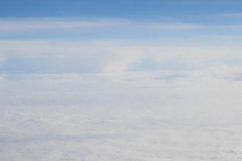 High above the clouds close to sun Stock Photos