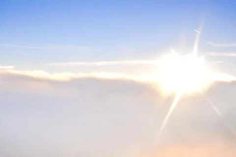 High above the clouds close to sun Stock Photos