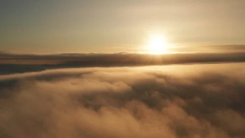 High above clouds elevated aerial time lapse view at sunrise 動画素材 118592420