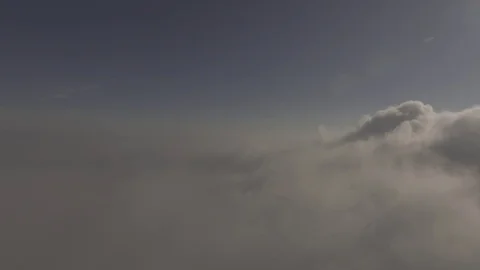 High above the clouds is a mist formation In the right corner, 4K Stock Footage 72905741