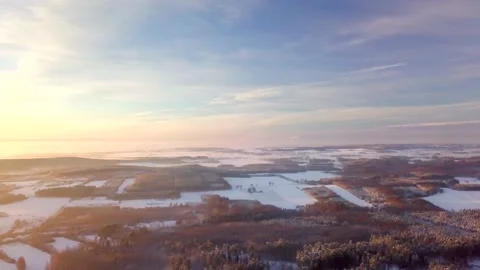High above flight over winter forests and fields, 4k AERIAL. Stock Footage 167348481